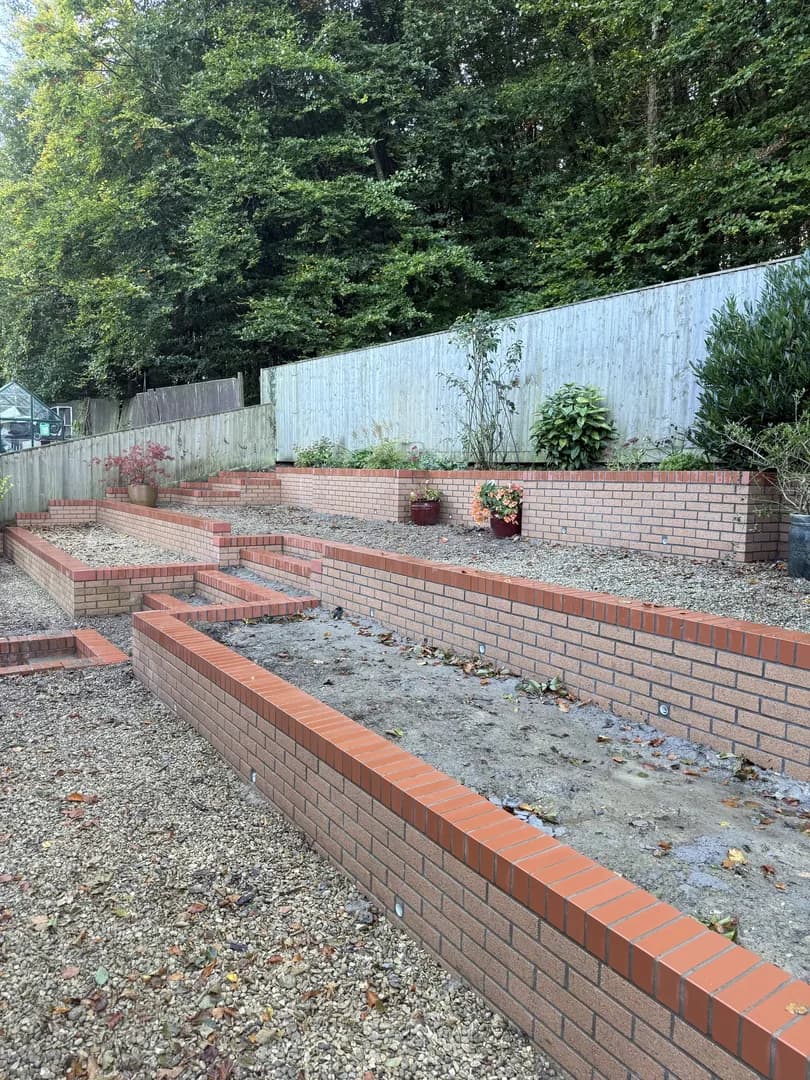 Brick garden wall with pillars and steps in Porthcawl