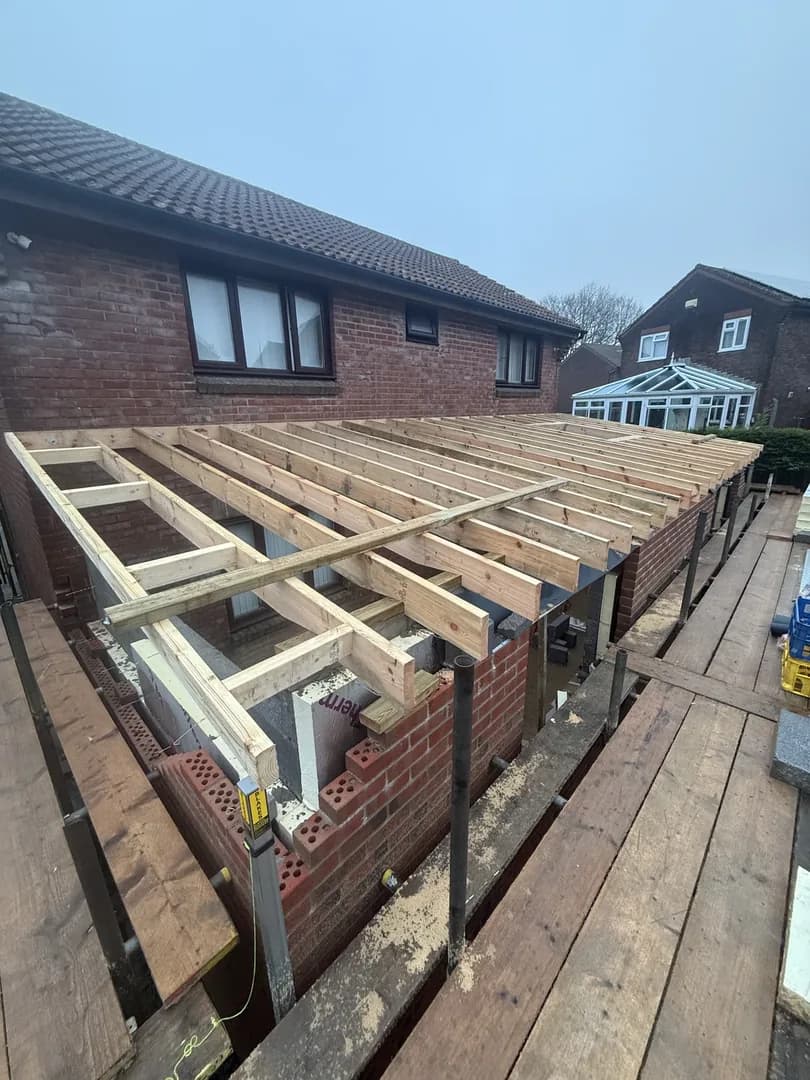 Double-storey brick extension with timber frame in Bridgend