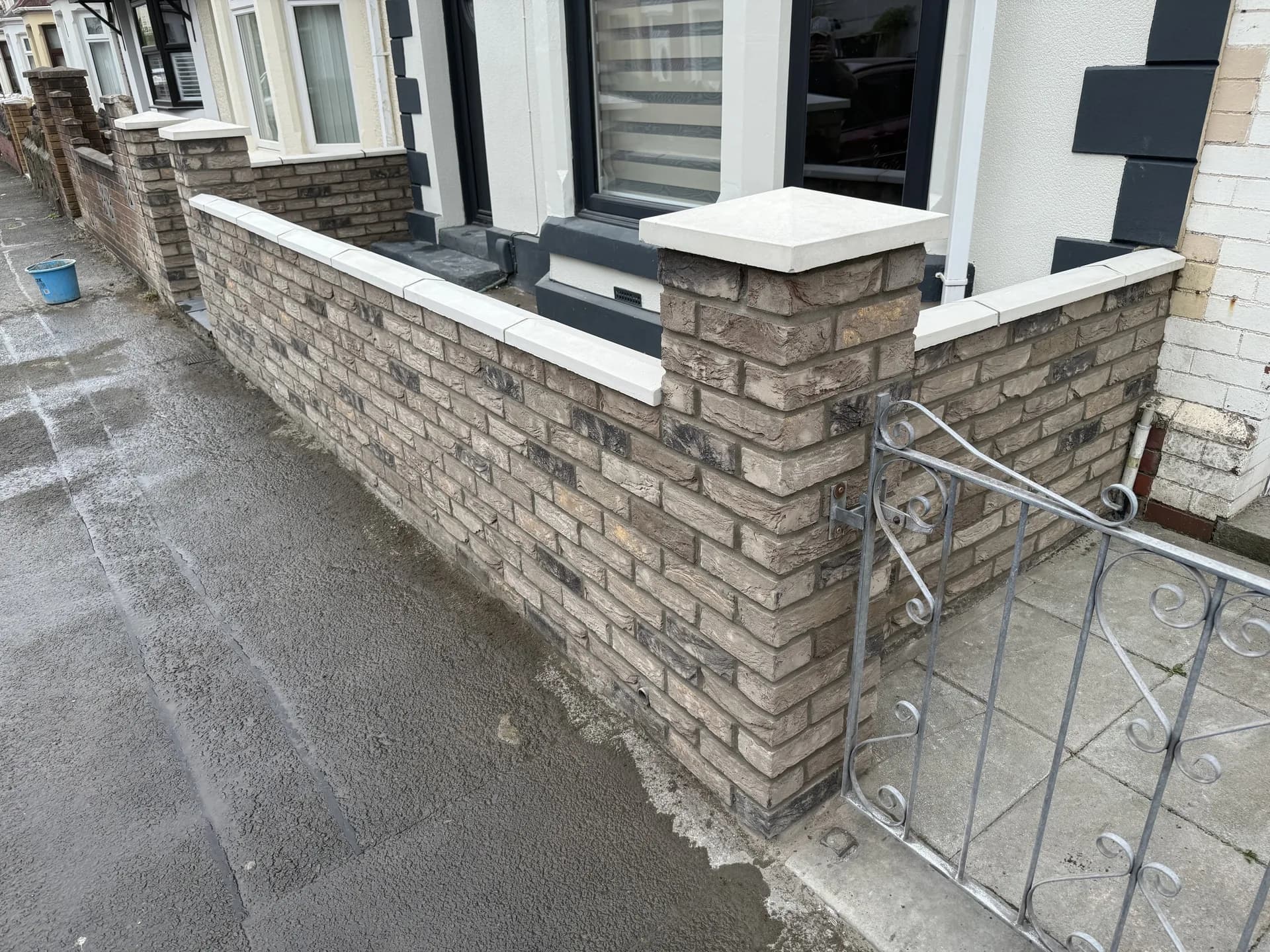 Front garden brick wall with metal gate in Bridgend