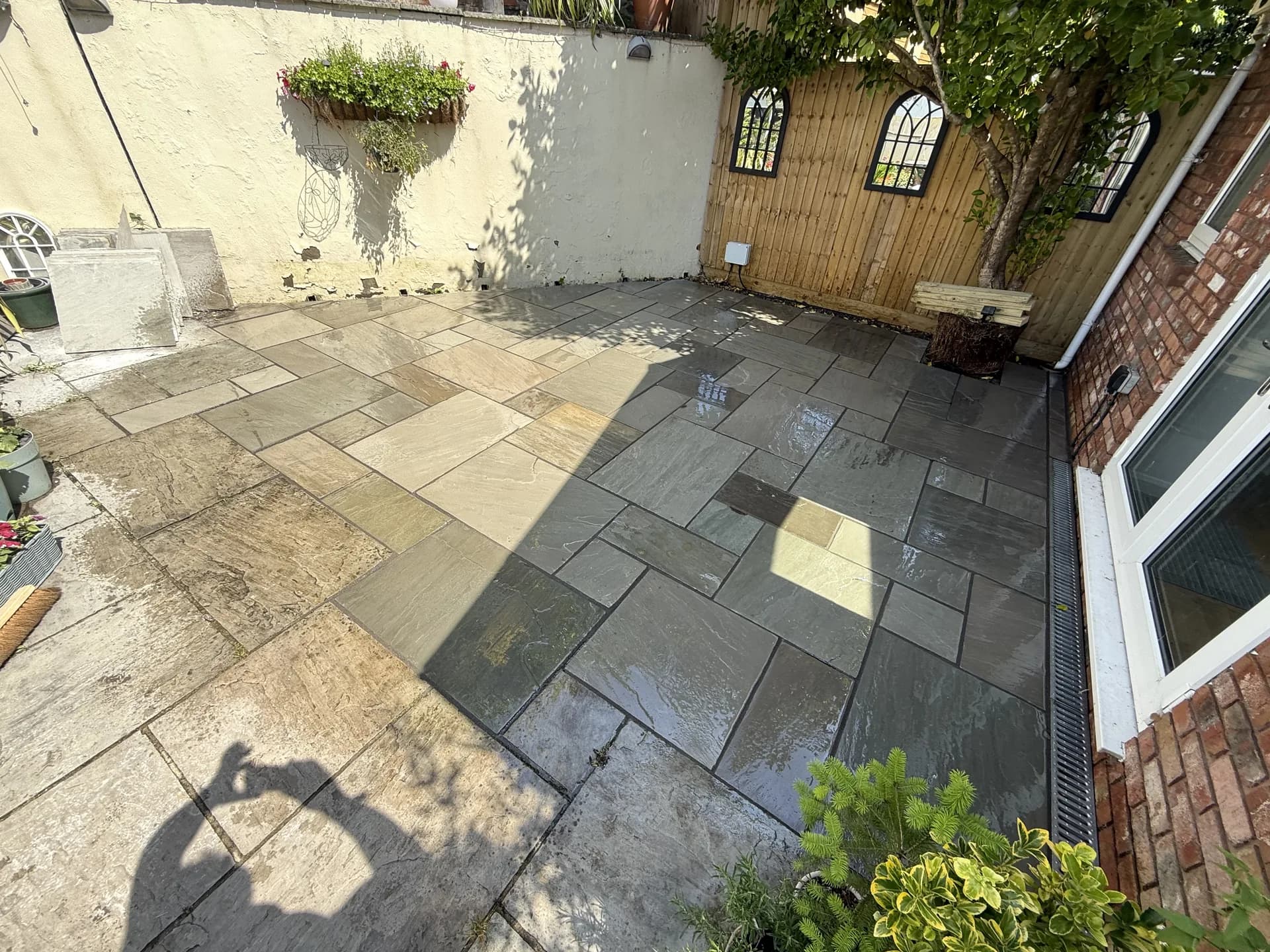 Natural stone patio garden transformation in Porthcawl