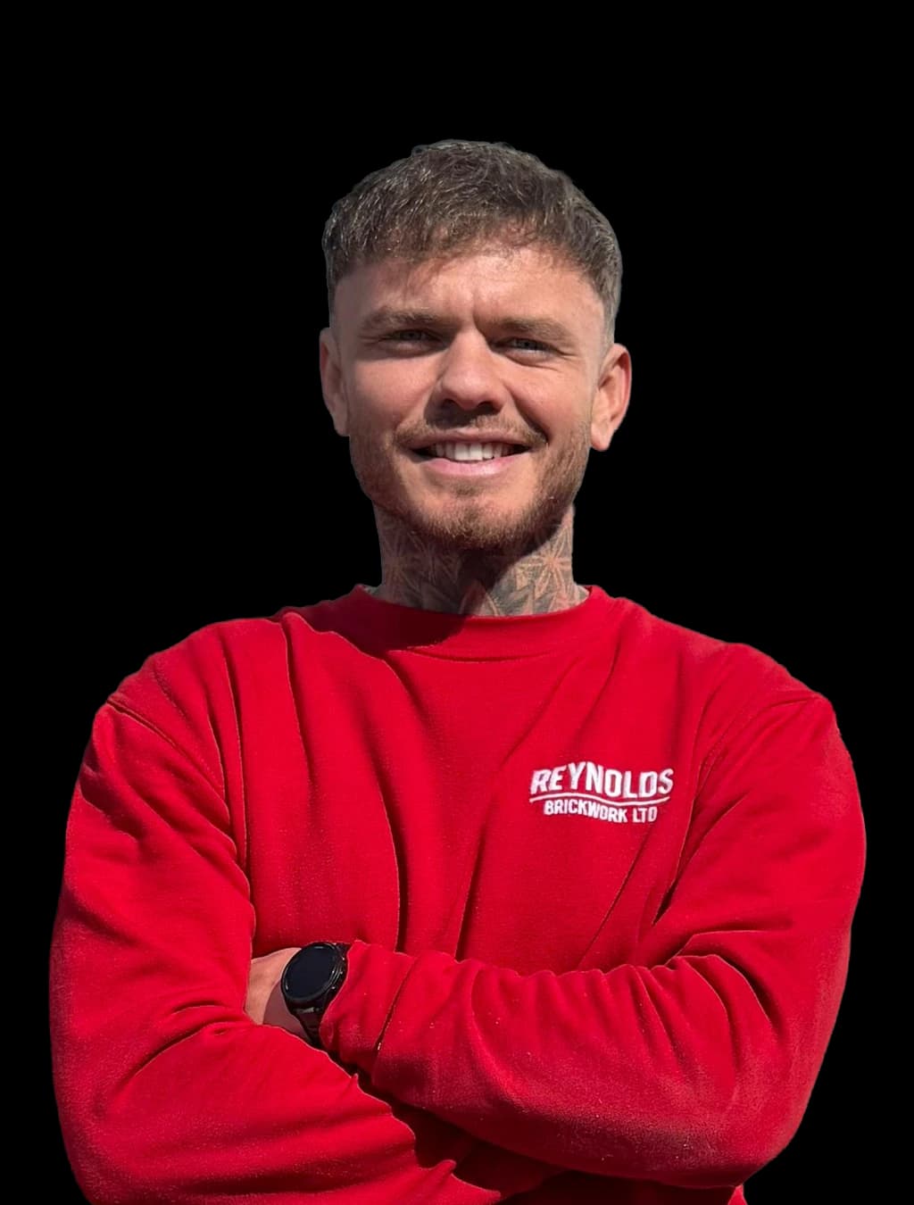 Ben Reynolds, Director and Lead Bricklayer, in red Reynolds Brickwork workwear