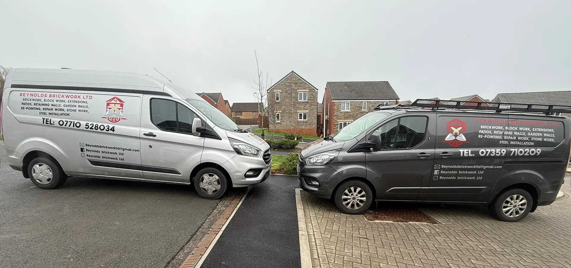 Two sign-written Reynolds Brickwork vans parked in Bridgend